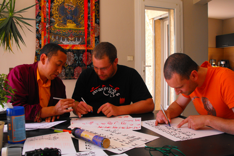 Learning Tibetan Calligraphy - From L. to R. : Lama Yönten, Namkhaï, Bhikkhus